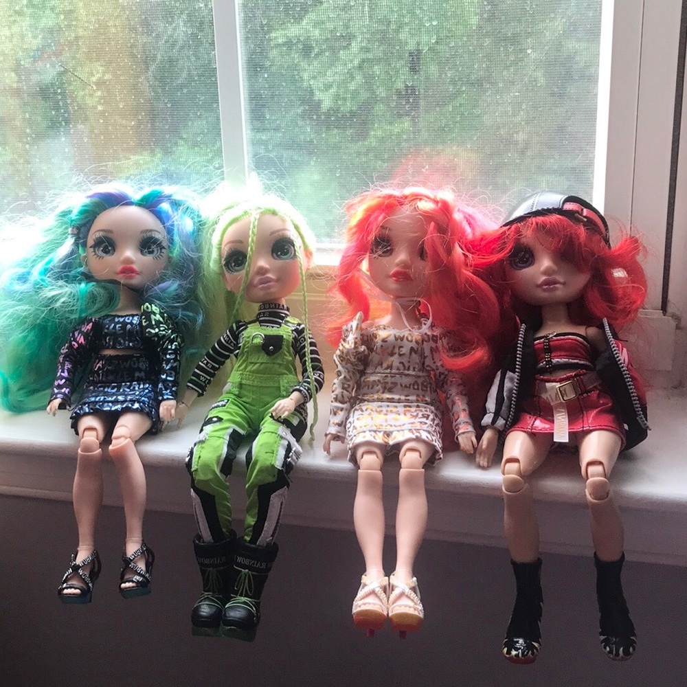 4 like-new rainbow high dolls.